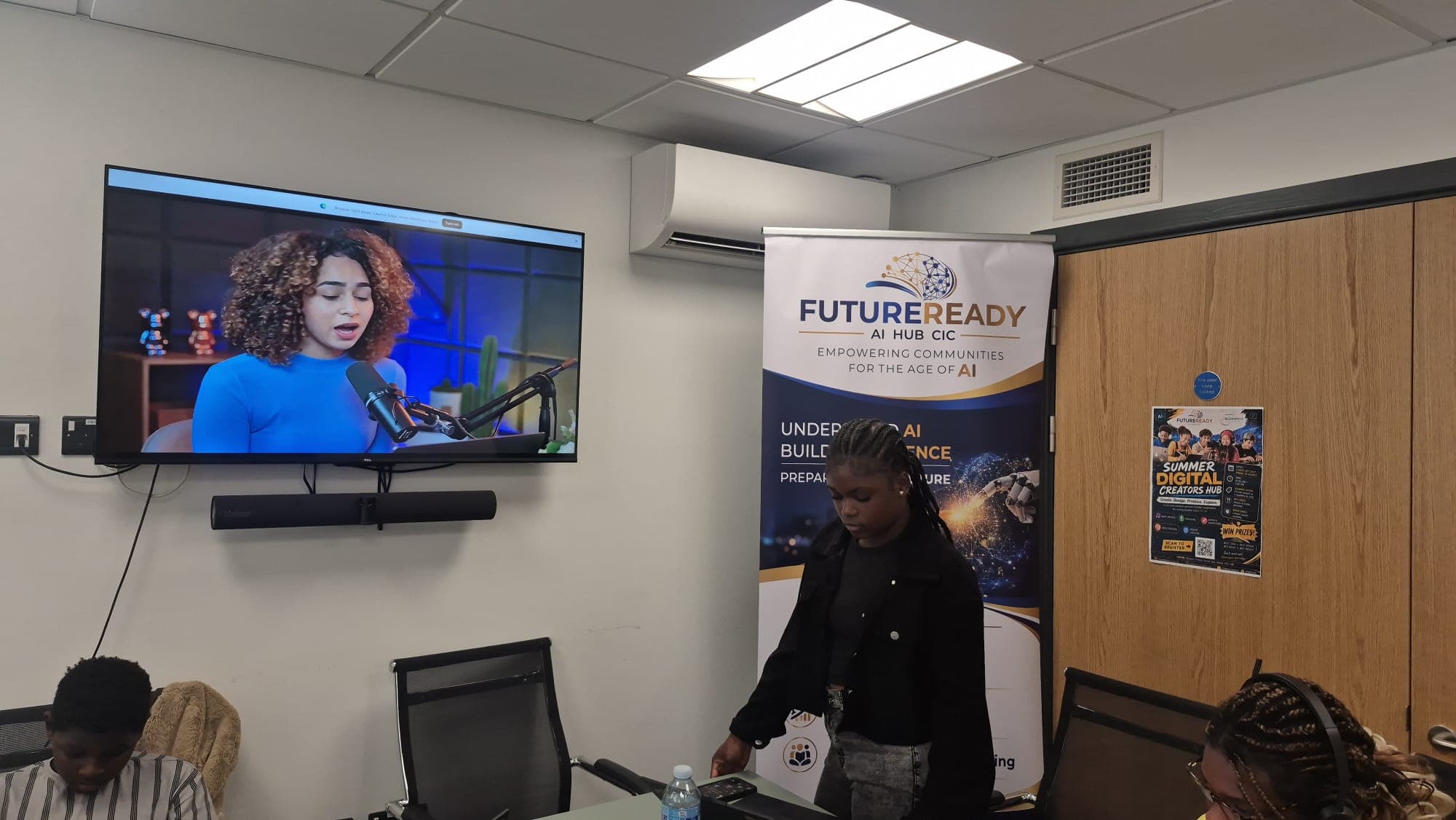 Participants watching an AI-generated podcast video as part of the video creation session