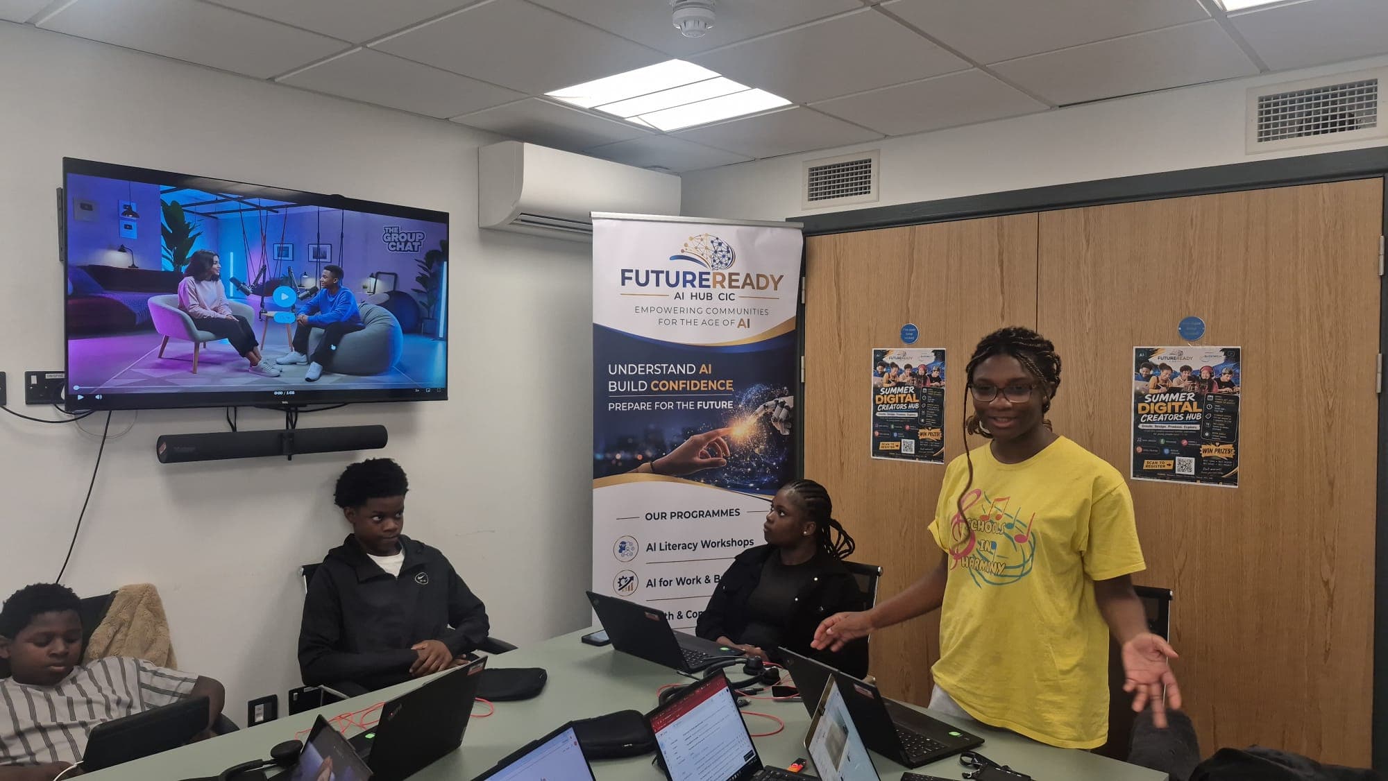 A participant talking through her AI podcast project with the group