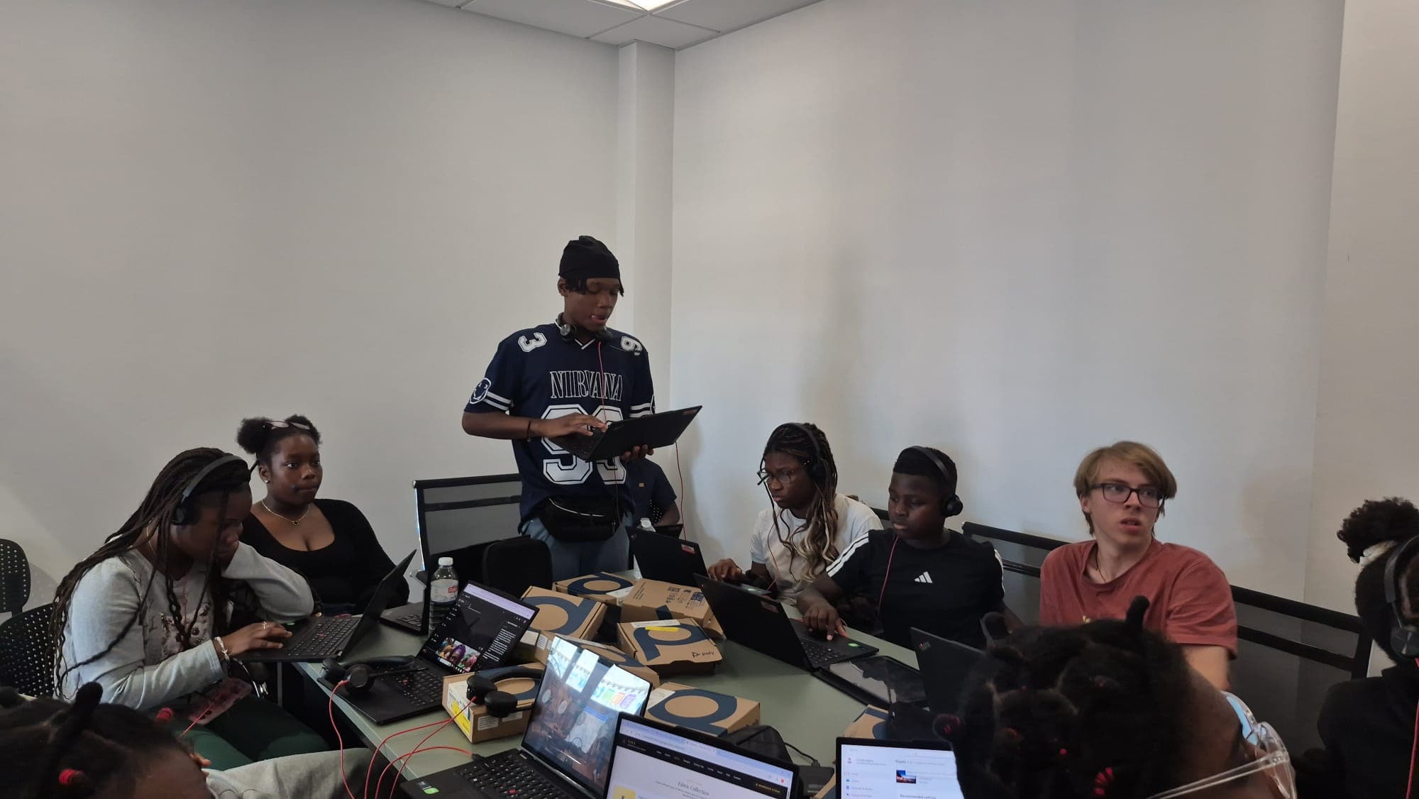 A participant presenting his work to the rest of the group at the digital hub