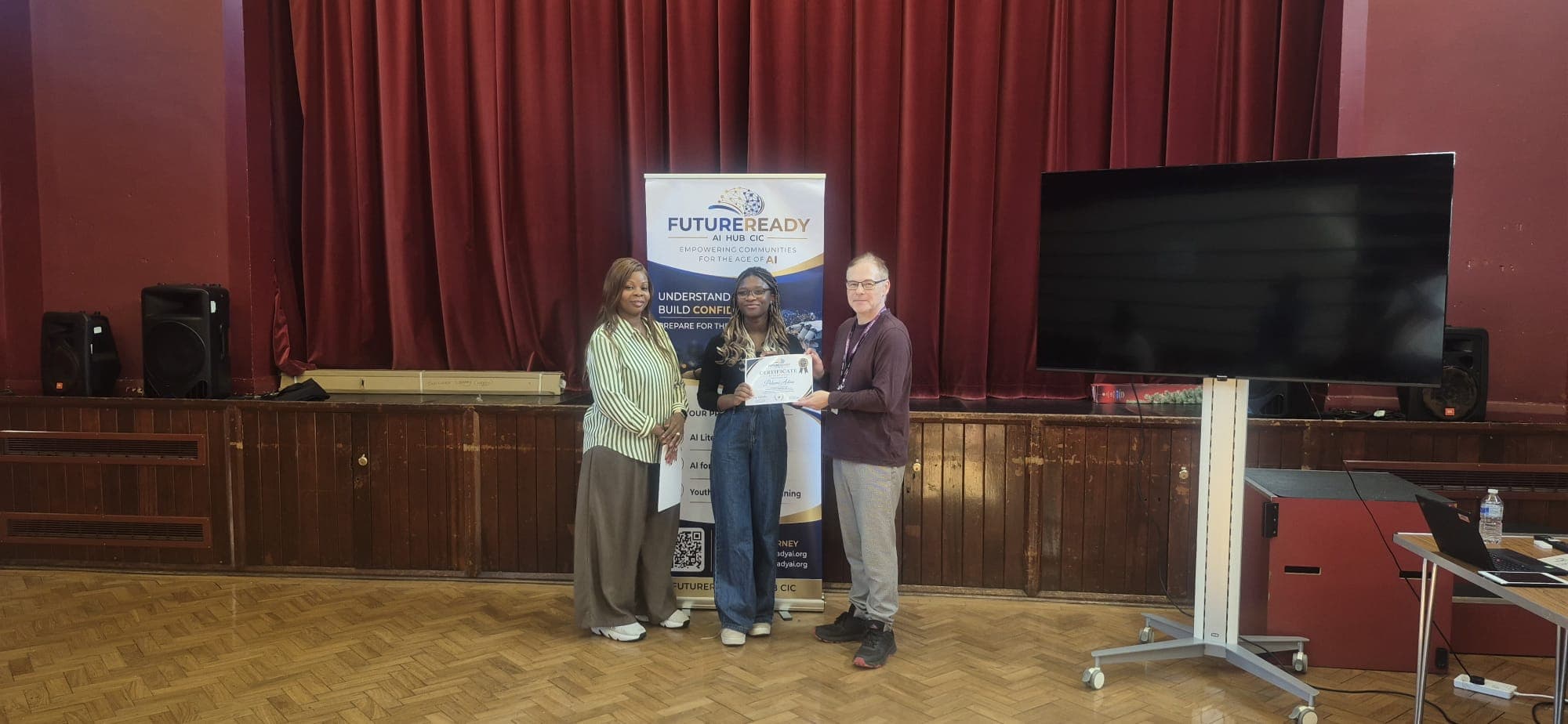 A participant receiving their certificate at the end of the FutureReady summer programme