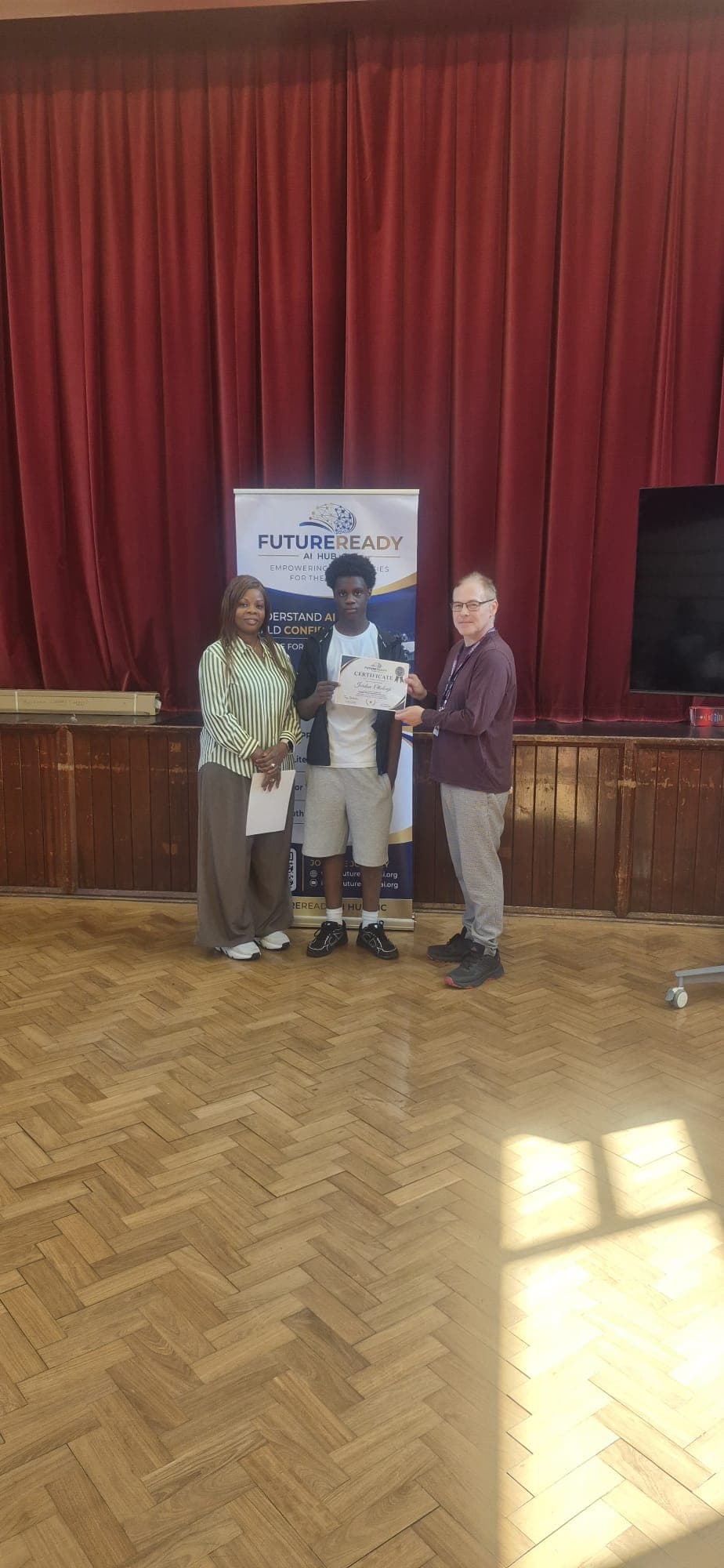 A participant receiving their certificate at the end of the FutureReady summer programme