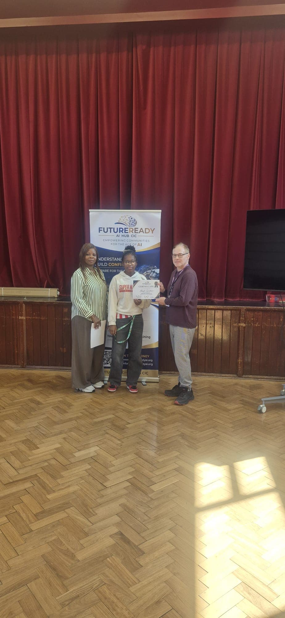 A participant receiving their certificate at the end of the FutureReady summer programme