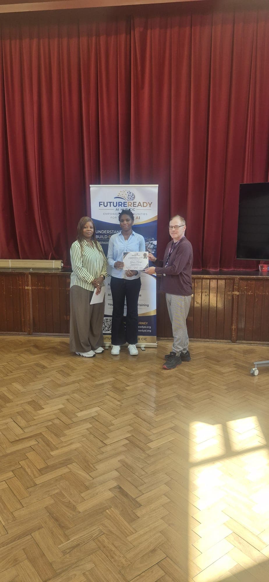A participant receiving their certificate at the end of the FutureReady summer programme