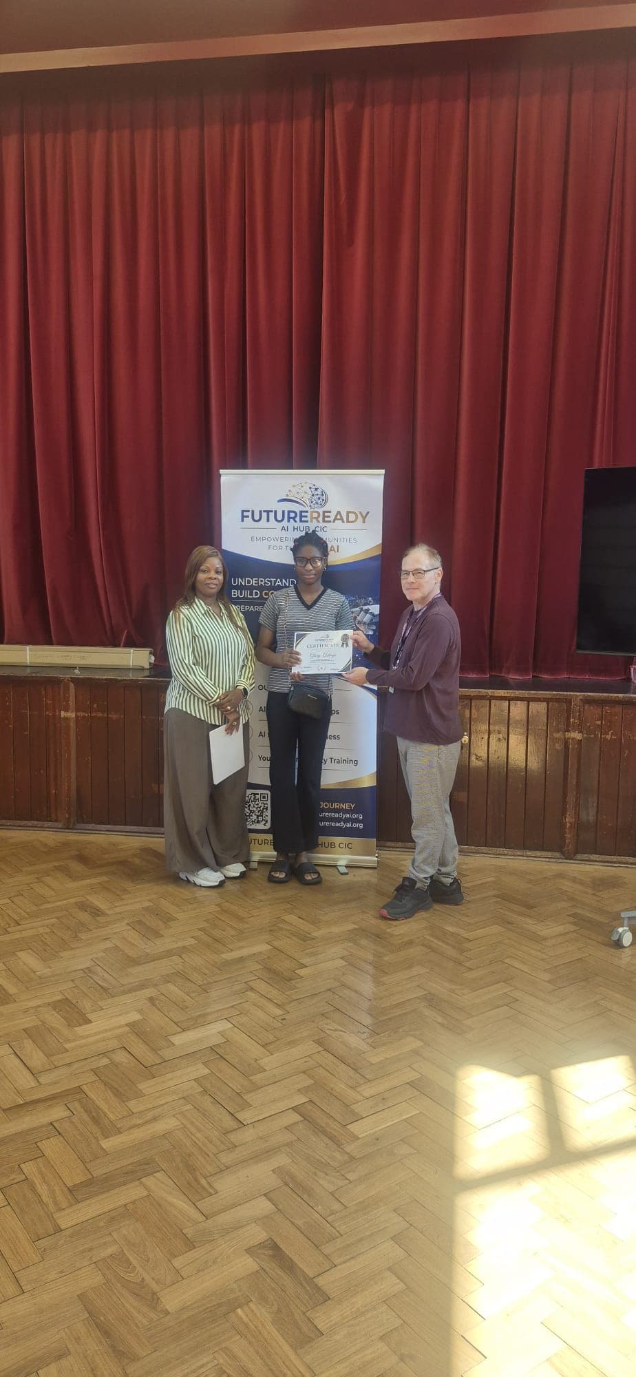 A participant receiving their certificate at the end of the FutureReady summer programme