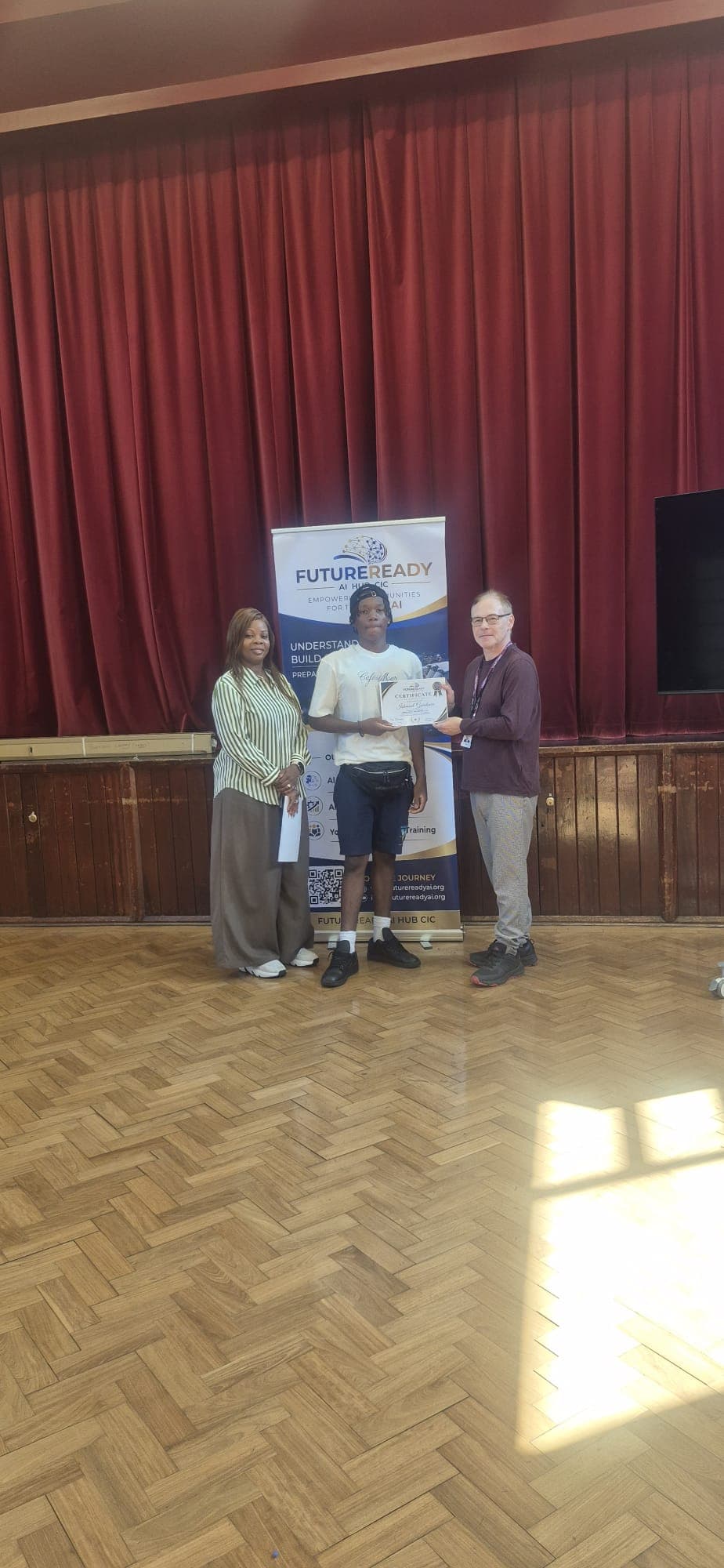 A participant receiving their certificate at the end of the FutureReady summer programme