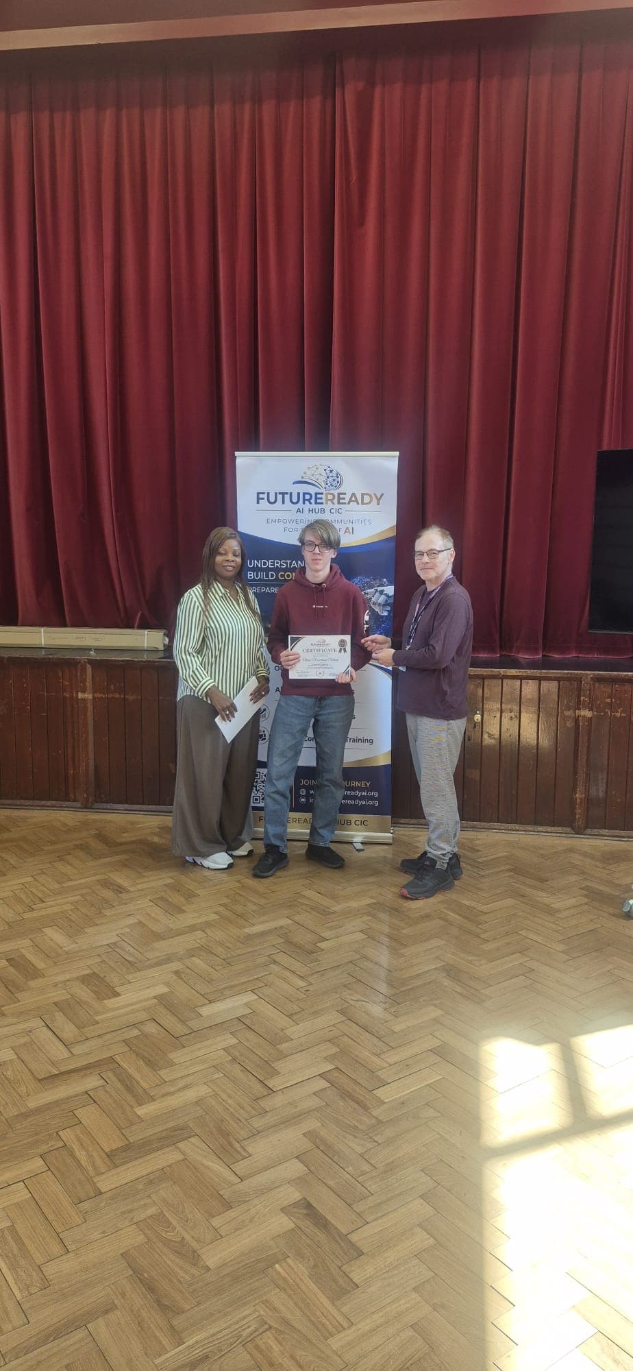 A participant receiving their certificate at the end of the FutureReady summer programme
