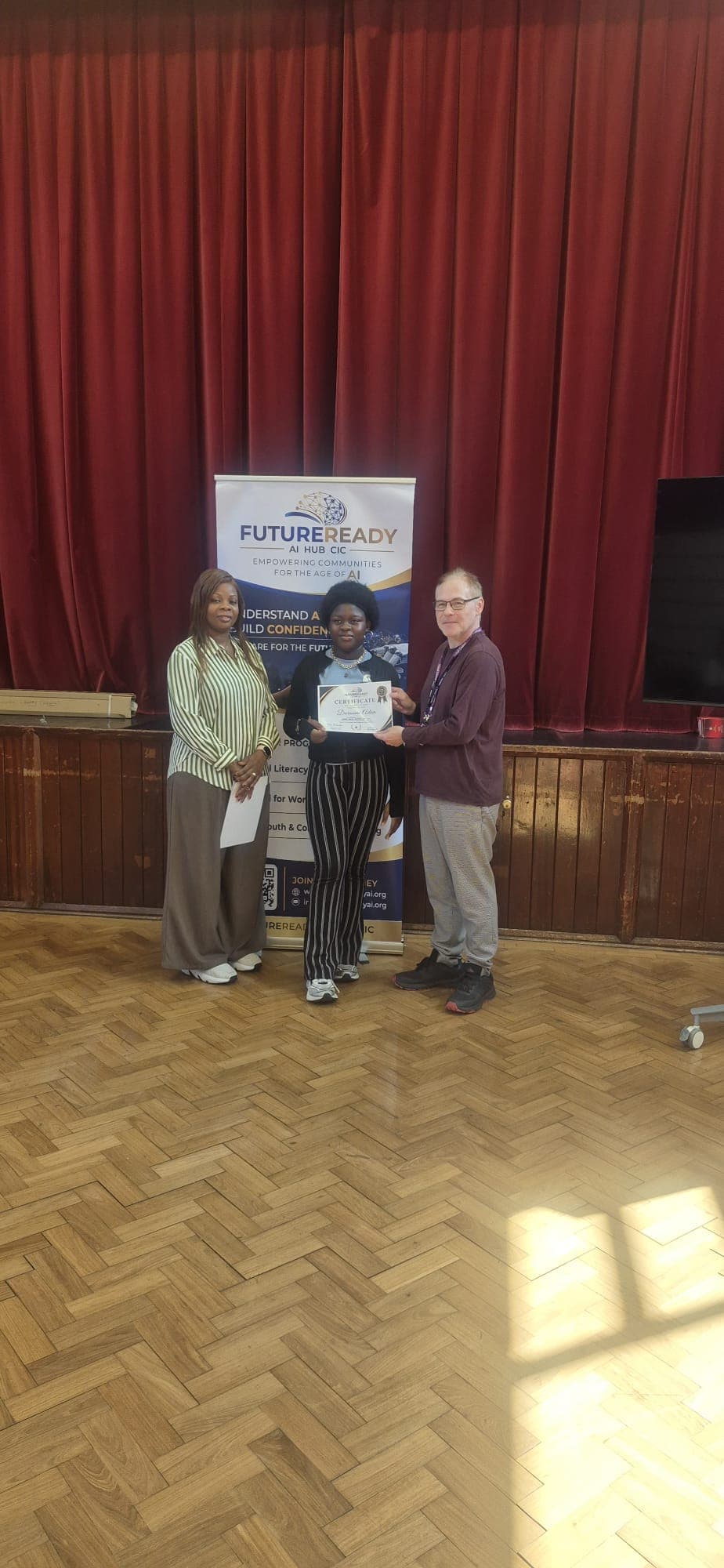 A participant receiving their certificate at the end of the FutureReady summer programme