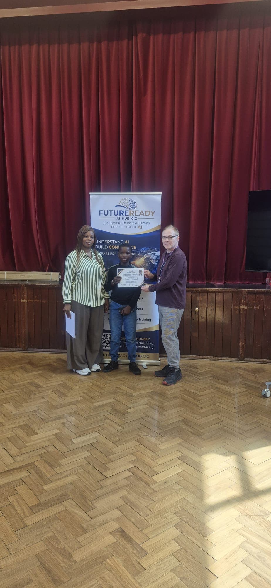 A participant receiving their certificate at the end of the FutureReady summer programme