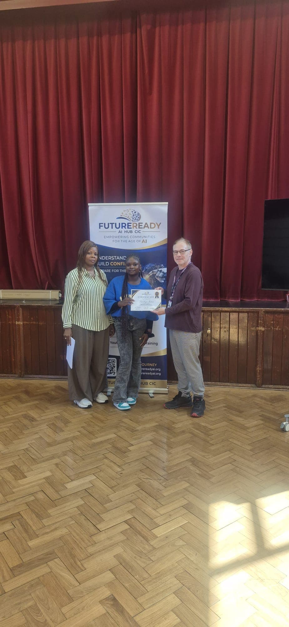 A participant receiving their certificate at the end of the FutureReady summer programme