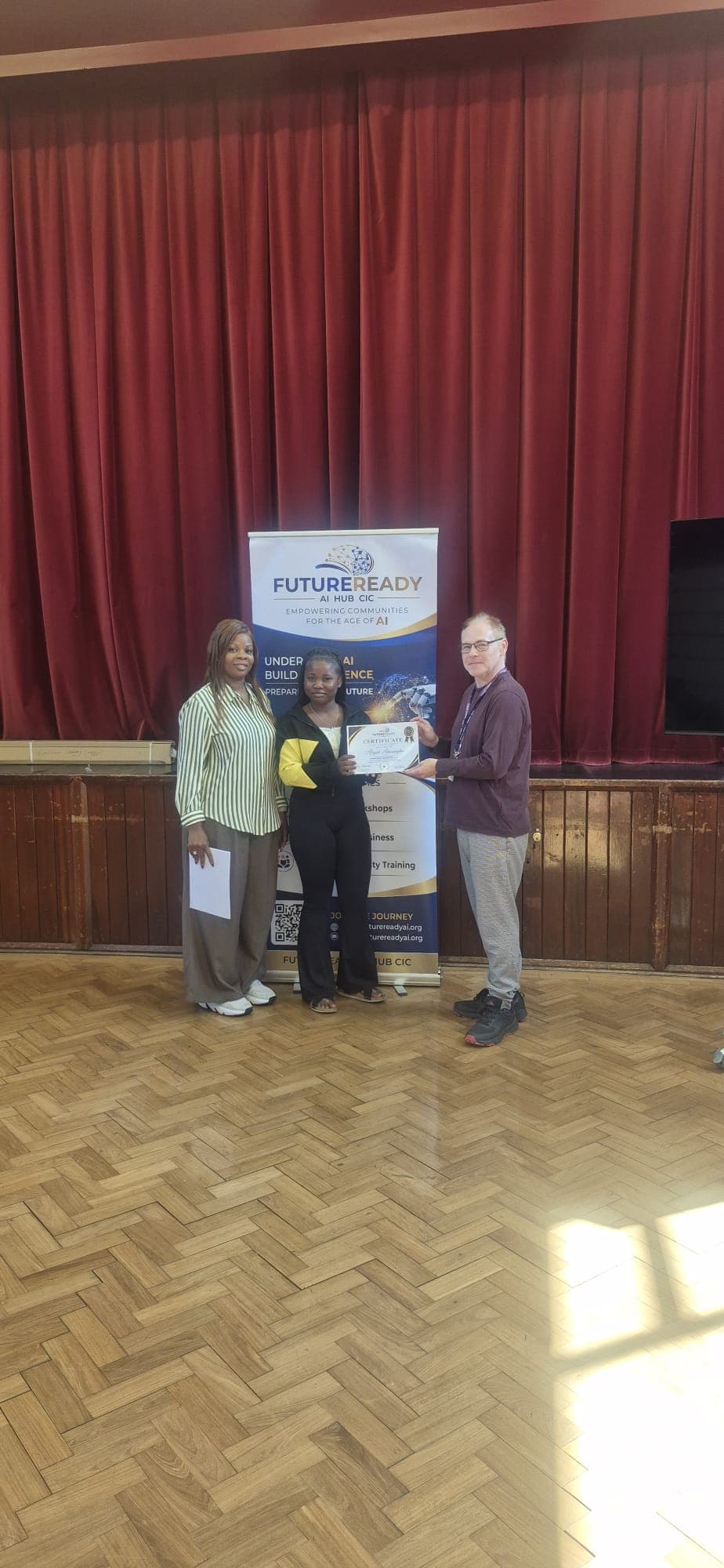 A participant receiving their certificate at the end of the FutureReady summer programme