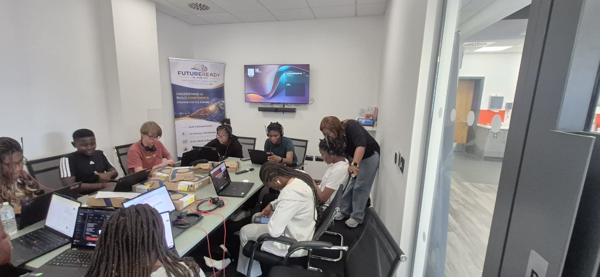 Participants working on laptops during a FutureReady AI workshop