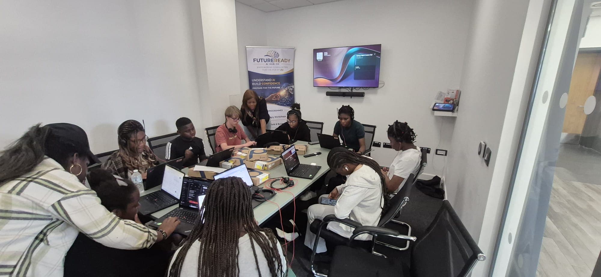 Participants working on laptops during a FutureReady AI workshop