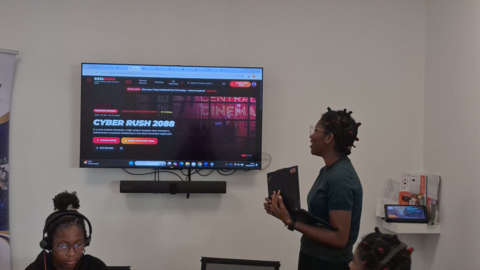 A participant presenting their project to the group during a workshop session