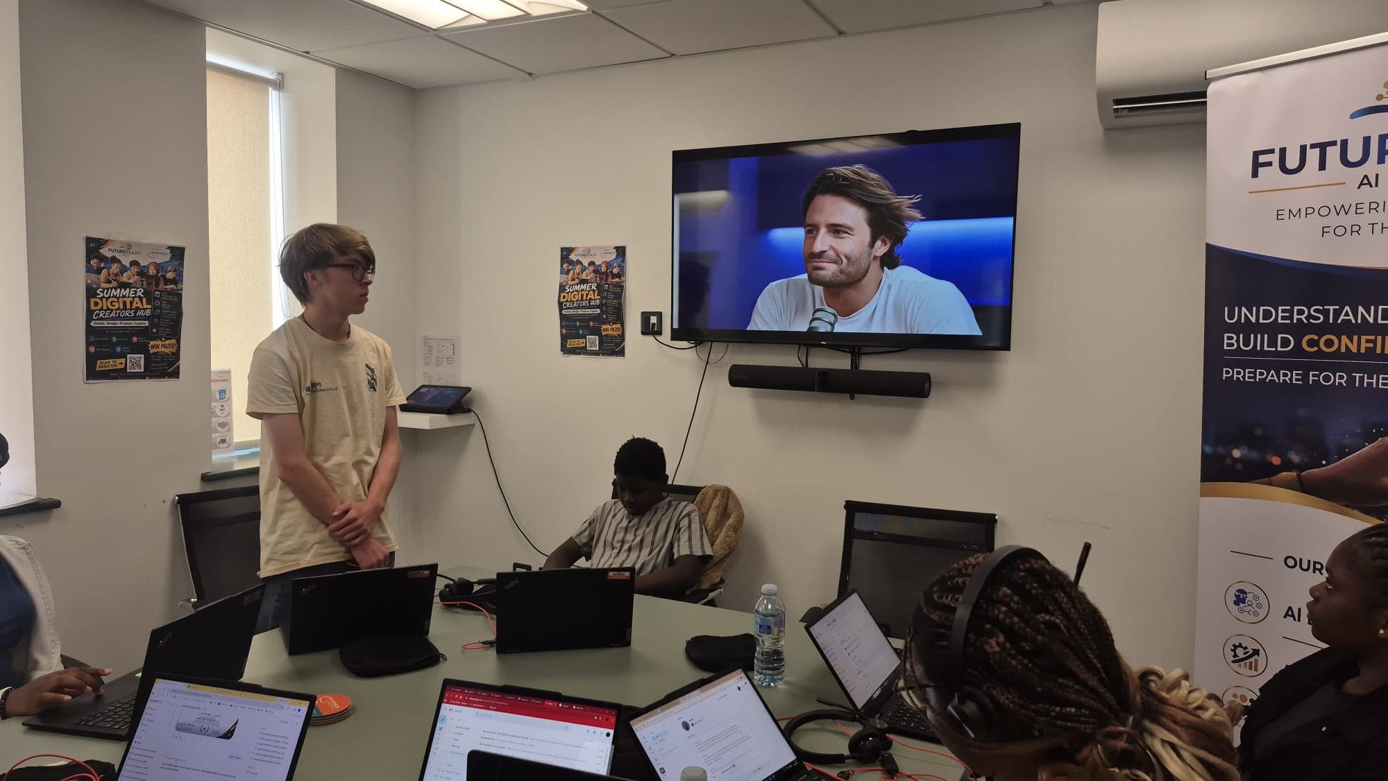 Participants working on their AI projects at the digital hub