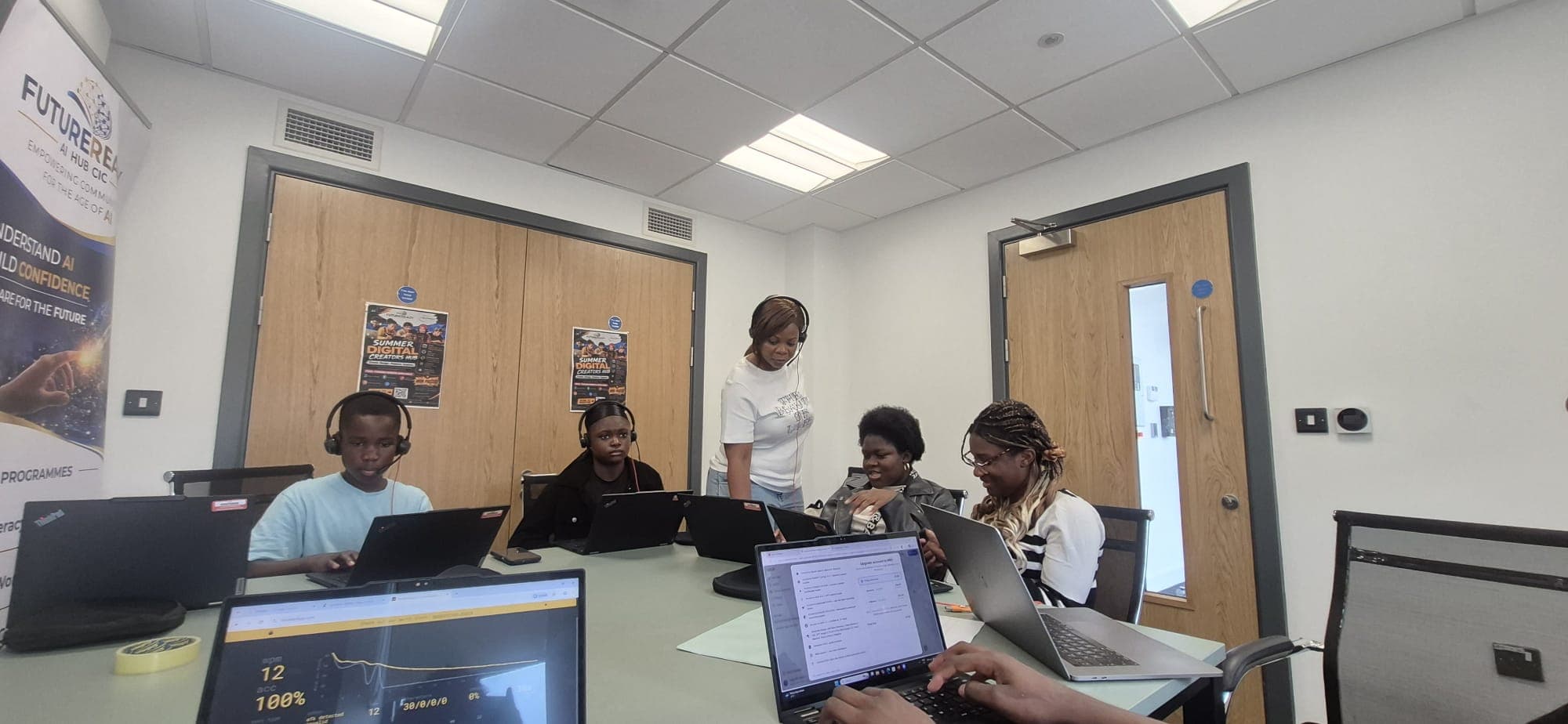 Participants working on their AI projects at the digital hub